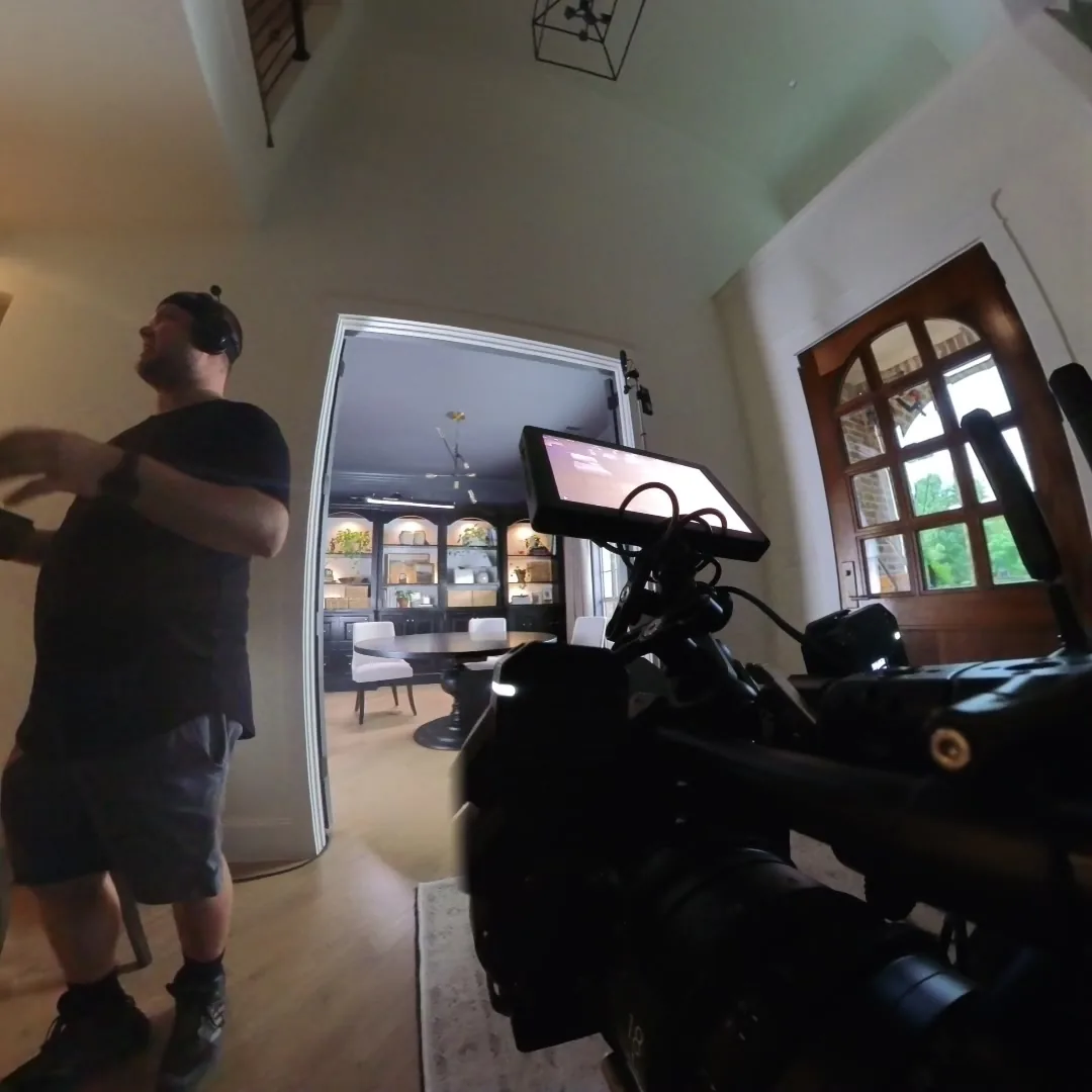 360-camera still of the RED camera and a crew member on set
