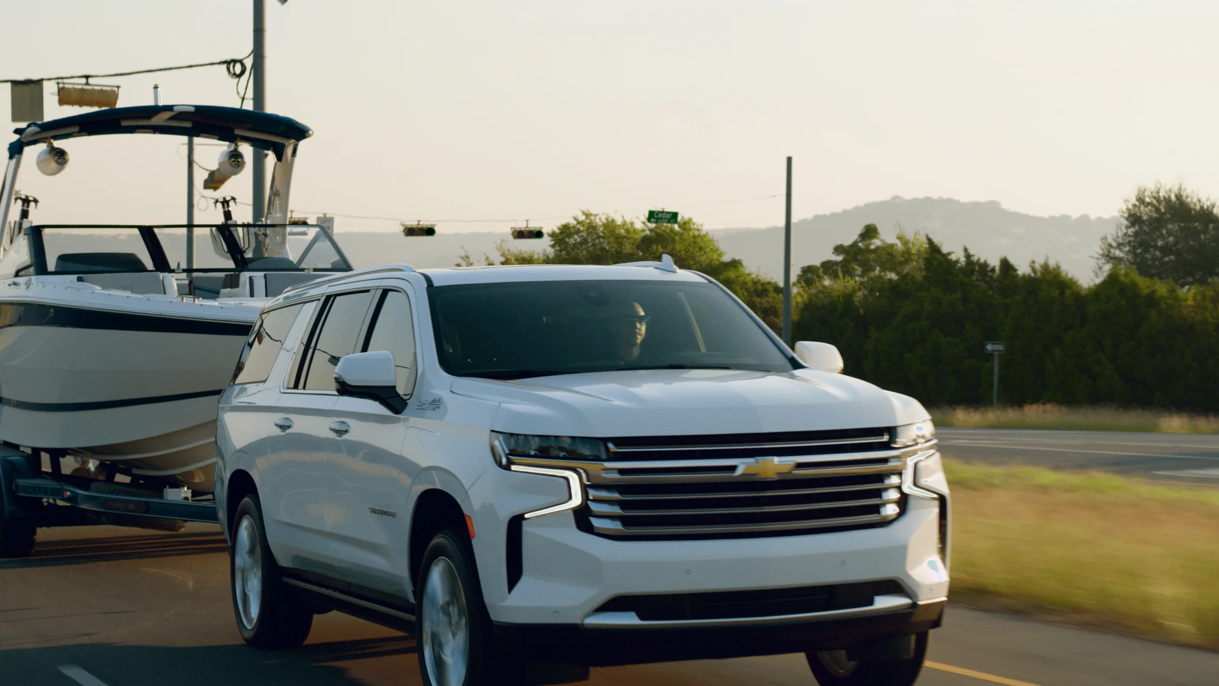 Tracking close on the Suburban and Cobalt on a Hill Country highway