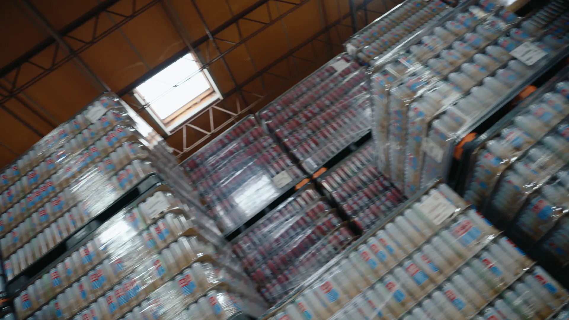 High angle over pallets of packaged spray cans in the warehouse