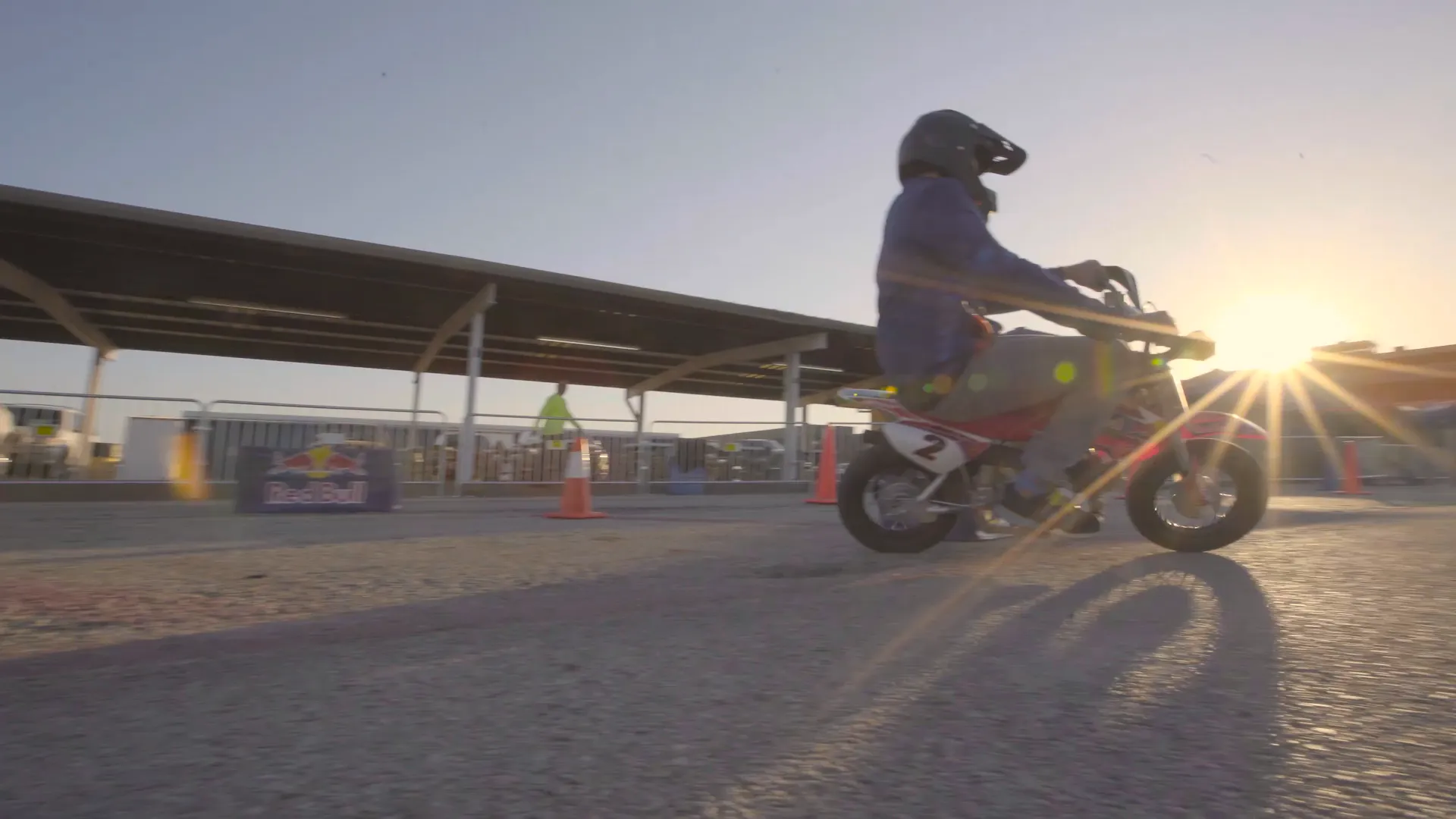 A rider backlit by the setting sun