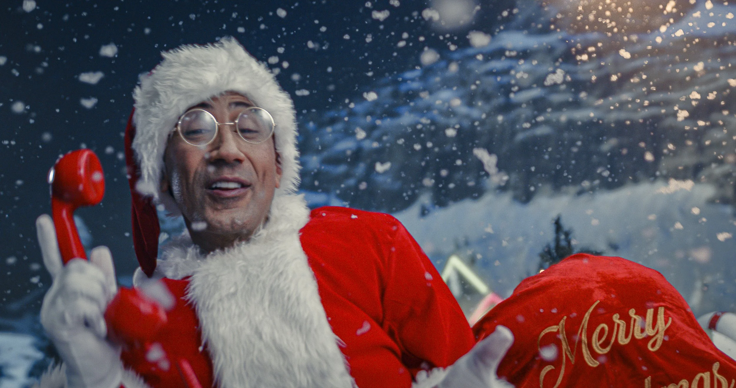Coca-Cola Santa campaign still on LED wall — warm interior holiday lighting