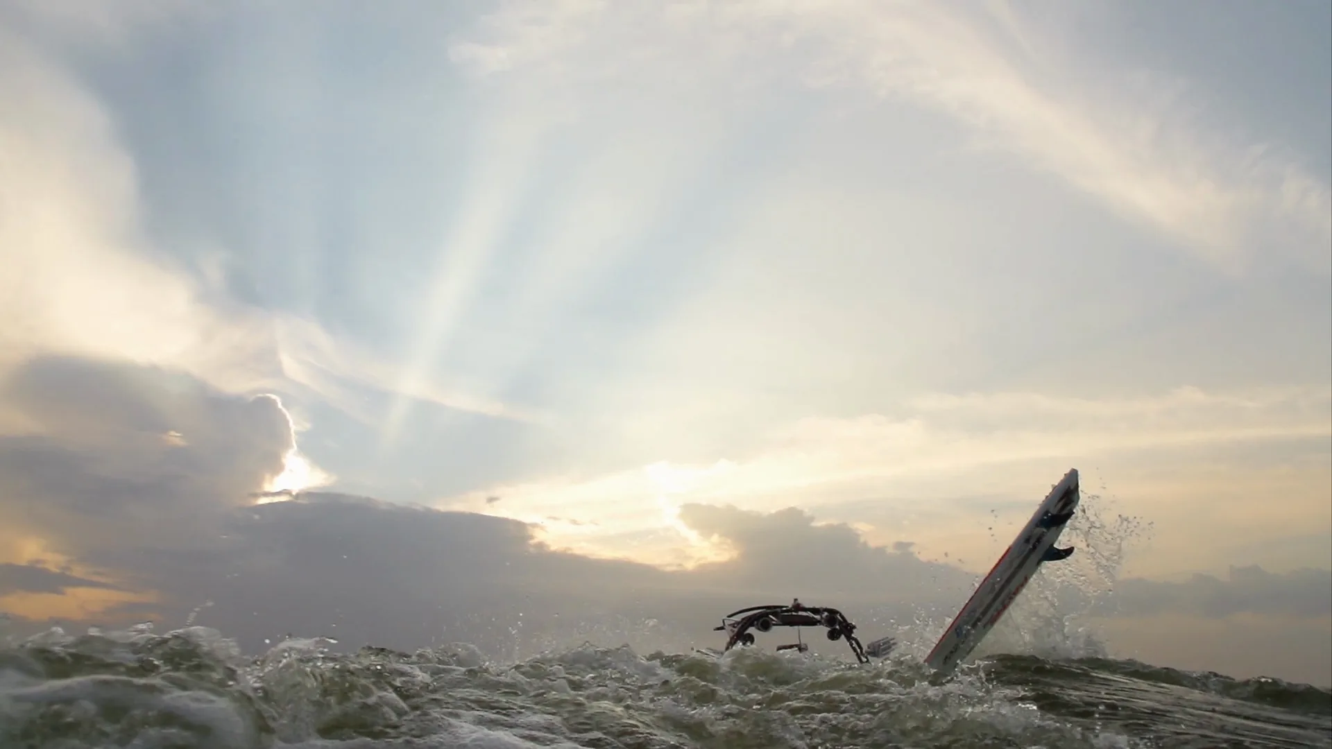 Sun rays break through clouds as a board flies up behind the Supra's tower