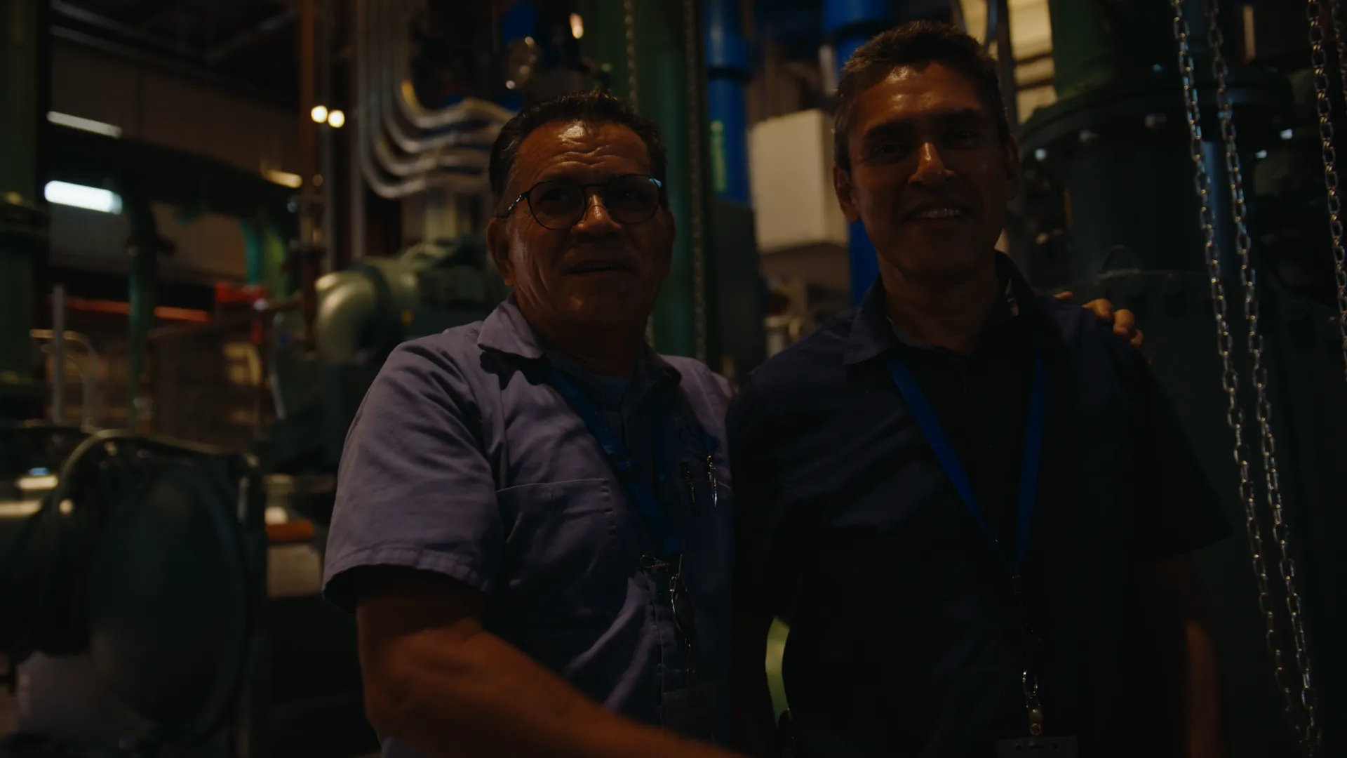 Two technicians smiling in the plant room