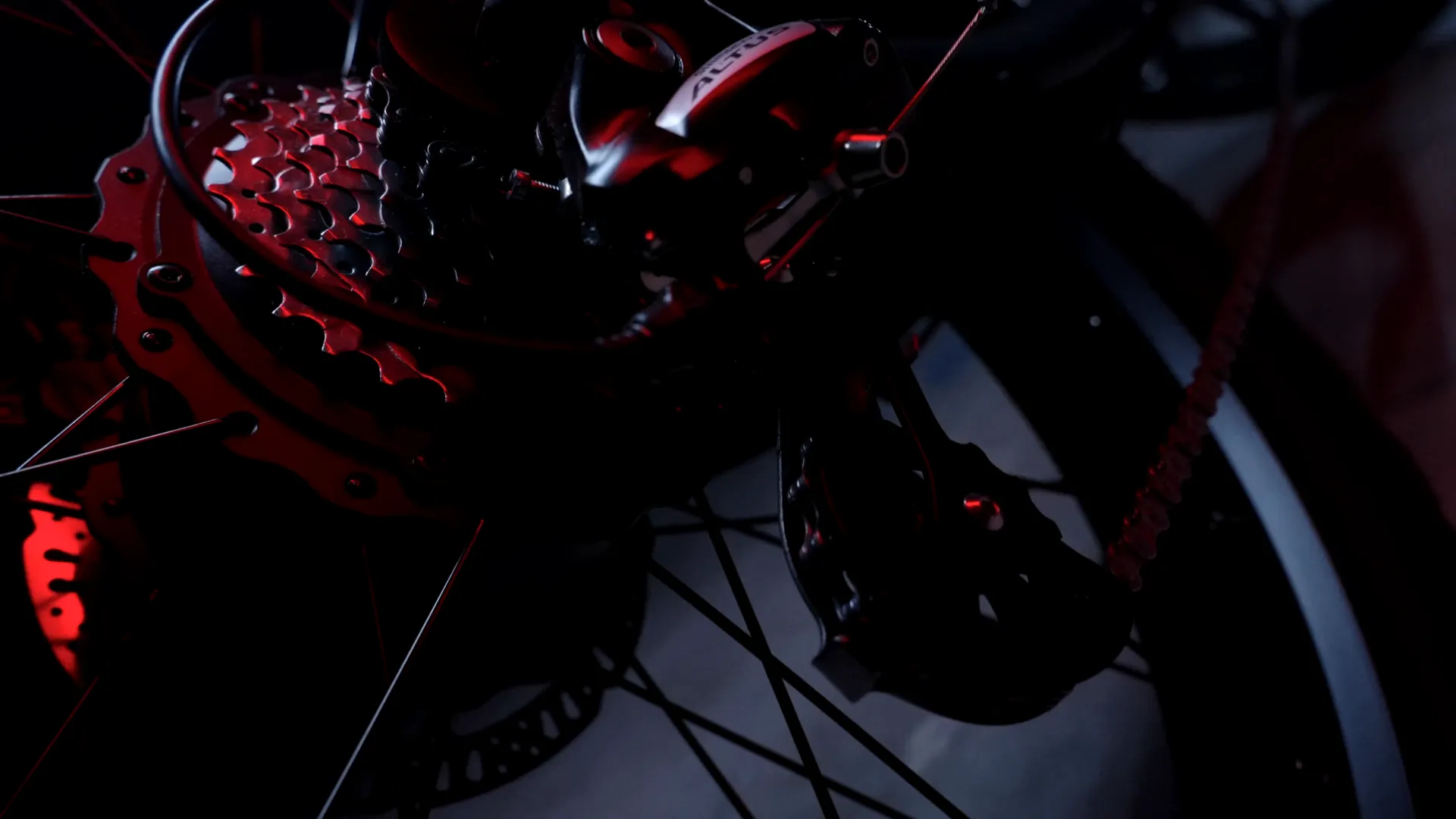 The drivetrain and rear sprocket lit red