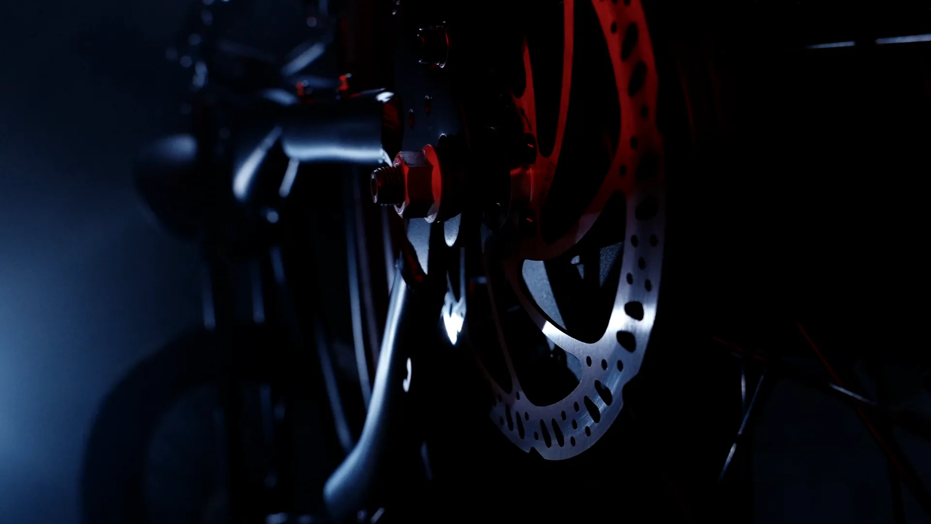 Close on the disc brake and fork in low light